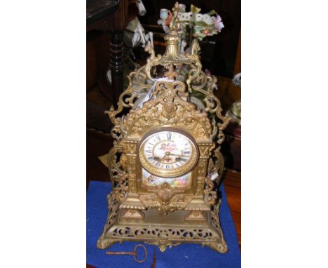 Decorative pierced brass mantel clock with porcelain plaque - 46cm high