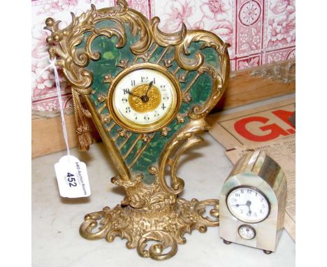 Decorative gilt harp shaped mantel clock, together with a bedside Mother-of-Pearl clock