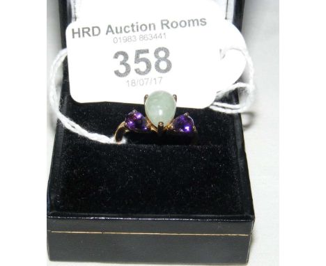 A 9ct gold jade and amethyst three stone ring