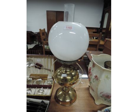 A brass bodied converted oil lamp