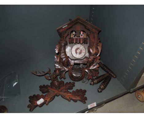 A wooden carved cuckoo clock