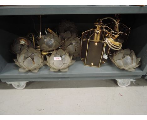 A selection of Capiz shell lotus flower style light shades and two brass effect lantern style shades
