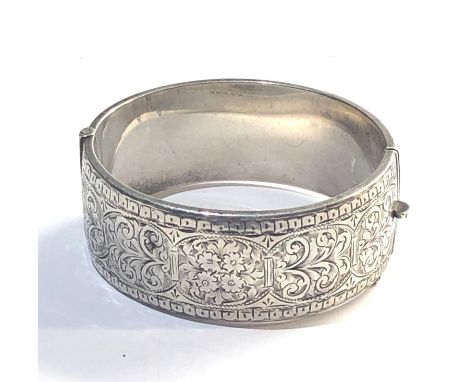 Silver cuff bangle measures approx 25mm wide Birmingham silver hallmarks,&nbsp;small dents to bangle, near hinge