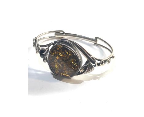 Vintage silver bangle with large amber centre 