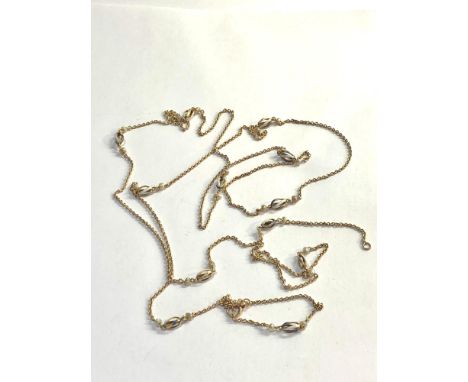Antique high carat long gold muff chain with pearl and enamel spacers not hallmarked but xrt as 14ct gold 