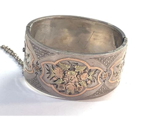 Victorian Aesthetic silver cuff bangle measures approx 32mm wide,&nbsp;bangle has sustained some dents and wear scratches to 