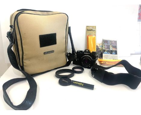 Cased Nikon camera with lens  and paper work please see images for details 