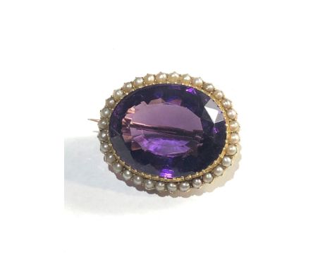 Large antique 15ct gold amethyst and seed pearl brooch measures approx 33mm by 28mm the amethyst measures approx 25mm by 21mm