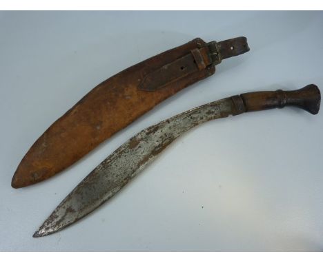 Late 19th century wooden handled Kukri knife with leather scabbard. Unmarked blade. 