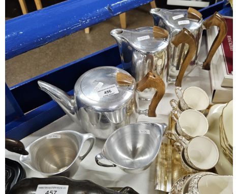 5 PIECE PICQUOT WARE TEA SERVICE COMPRISING 2 HOT WATER BOTTLES, TEA POT, SUGAR AND CREAM