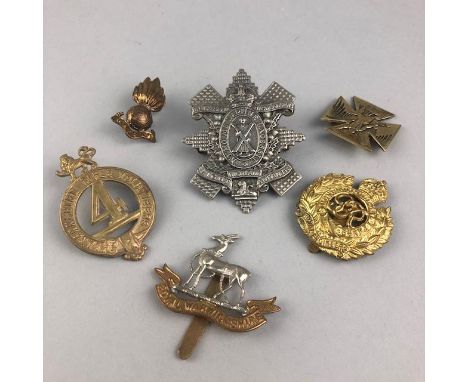 GROUP OF MILITARY CAP AND OTHER BADGES, including a Lalique brass medal