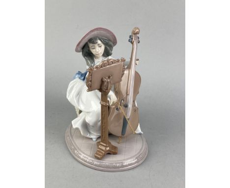 LLDARO GROUP OF A CELLIST, along with two other Lladro groups of female musicians, largest 24cm high