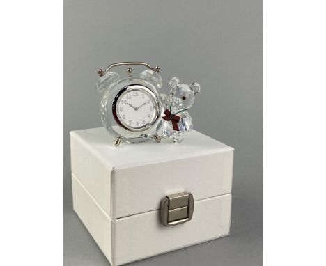 THREE SWAROVSKI CRYSTAL PERFUME BOTTLES, the tallest 11cm high, along with a swarovski crystal 'bear' table clock (4)