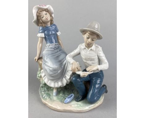 LLADRO GROUP OF CHILDREN ON A SEESAW, 23cm long, along with another Lladro figure and a Nao group of a girl and boy