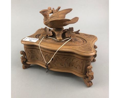 CARVED SANDALWOOD TRINKET BOX, the hinged lid with carved bird motif, 17cm high