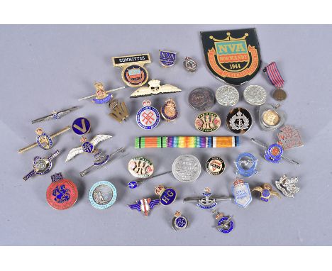 An assortment of sweetheart brooches and badges, to include a silver and tortoiseshell R.N.V.R, a bone Naval example, a selec