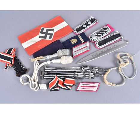 An etched SS blade letter opener, together with a reproduction armband, a dagger hanger, knots, epaulettes, cloth titles and 