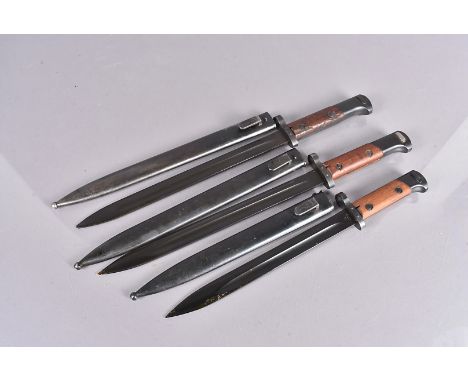 Two Czech VZ-24 bayonets, complete with scabbards, one stamped E3-48 to the scabbard and the bayonet, the other stamped E3-46