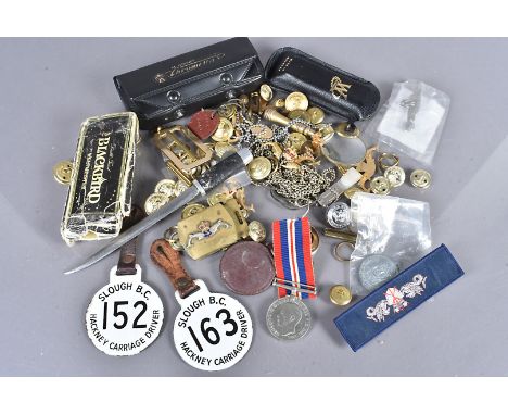 An assortment of items, to include a British WWI War medal, a selection of Naval buttons and badges, two enamel Slough B.C. H