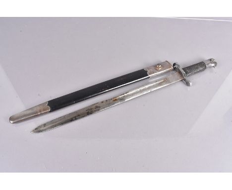 A British 1875 Sawback bayonet, with sawback removed, with maker's stamp to the 46cm long blade, complete with scabbard 