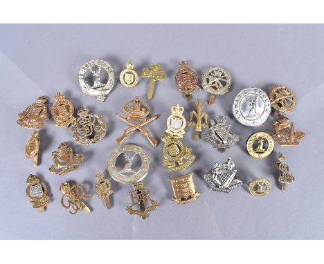 A collection of Victorian to Post War British Cap badges, comprising Essex Yeomanry, Irish and Welsh Yeomanry, Lovat's Scouts