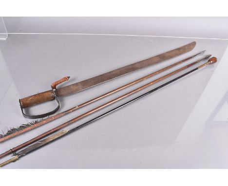 A group of three 19th Century arrows, including one with a Whistling Arrow Head, shagreen noch, and feather fletching, plus a