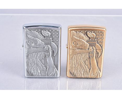 Eagle and Torch, two examples of the 2000 dated Zippo lighter, one in antique brass, the other in antique pewter, both with c