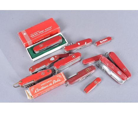 A collection of Victorinox Swiss Army Knives, various sizes and array of included equipment, together with a selection of sim