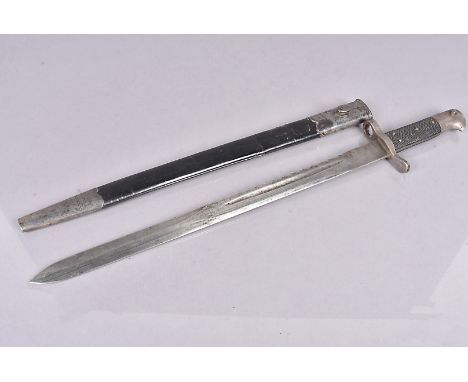 A British 1875 Pattern Volunteer sawback, with AC stamp to the 46cm long blade, complete with leather and steel scabbard (2) 