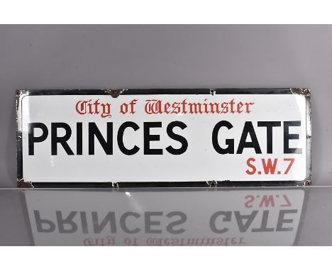 A City of Westminster enamel road sign, for Princes Gate, S.W.7, black and red lettering on white background, with black bord