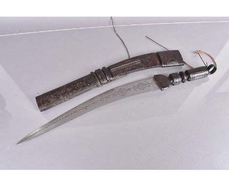 A Middle Eastern single edged sword, with 47cm curved blade, with engraved decoration, with leather bound handle and scabbard