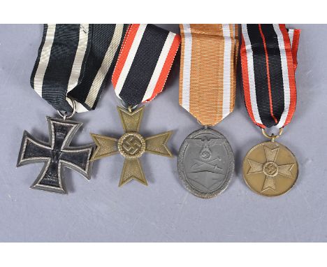 A German Iron Cross, two piece construction with magnetic centre, unidentified stamp to the hanger ring, together with a Meri
