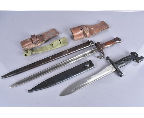 A French Bertie bayonet and scabbard, with matching numbers, together with a Spanish Bolo bayonet and scabbard, together with