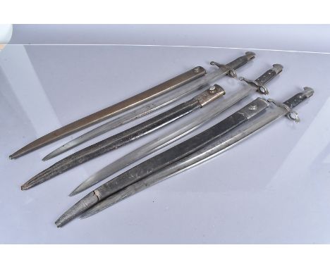 Three 1856 Yataghan bayonets and scabbards, one with steel scabbard, the other two with leather and steel scabbards, the leat