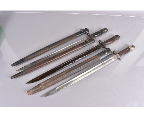 Three 1907 SMLE bayonets and scabbards, one by Lithgow and dated 22, another dated '12, with SLAZ 52 impressed to the wooden 