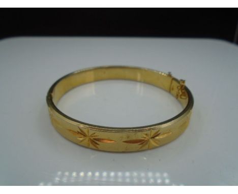 Rolled gold plated gate bracelet, stamped 18K