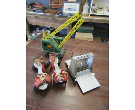 Vintage items including tin toy crane, roller skates and Sputnik coat hanger etc 