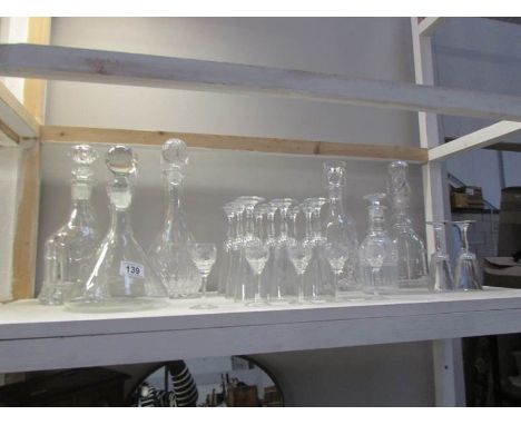 A shelf of decanters and glasses