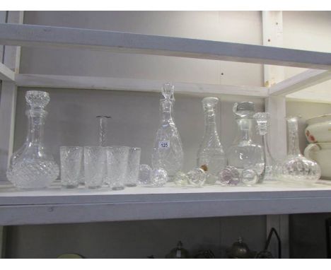 A shelf of decanters and glasses