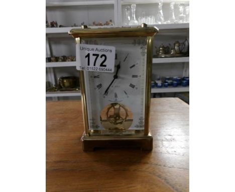 A modern brass carriage clock