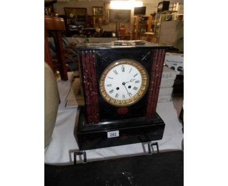 A 19th century black marble mantel clock