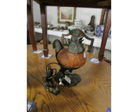 A table lamp in the form of a cockerel in metal and glass