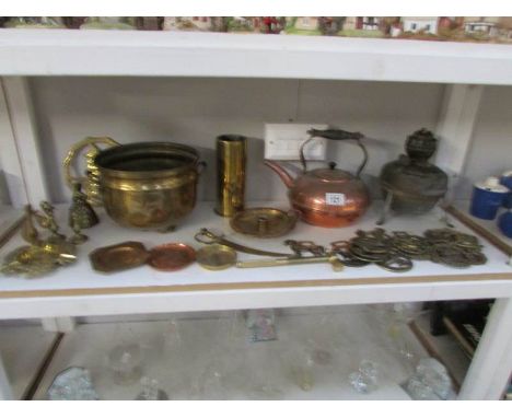 A shelf of brass and copper
