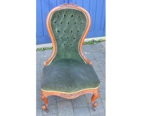 Victorian button back nursing chair in walnut on scroll legs with castors