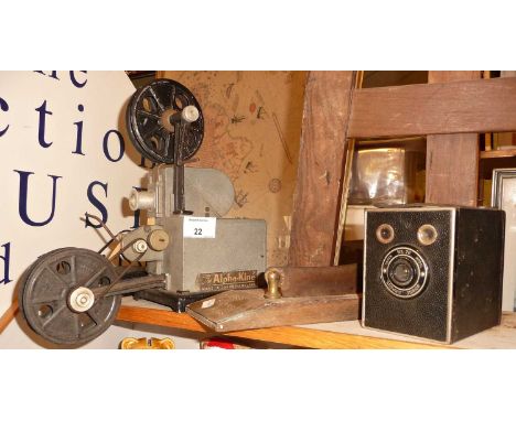 An Alpha-Kine 8mm projector, a Box Brownie camera and a Davies Famouse Twist tobacco leaf guillotine