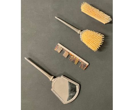 A Victorian style silver vanity set, comprising looking glass, comb, brushes, Birmingham 1957/58 (4)