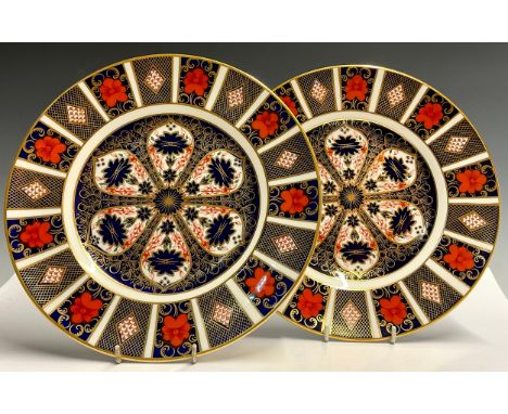 A Royal Crown Derby Imari 1128 pattern dinner plate, 27cm diameter, printed marks in red, first quality; another, second qual