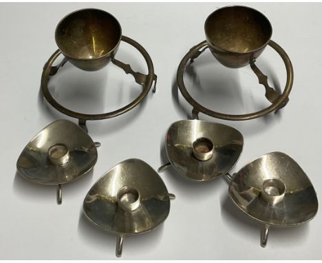 A set of four Carl Cohr for Atla silver plated candle holders, modernist triangular bowls, tripod feet, stamped COHR Denmark,