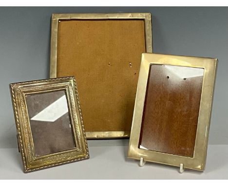 A George V silver picture frame, quite plain, the aperture 21cm x 15.5cm, Birmingham 1918; another, 19th century style, small