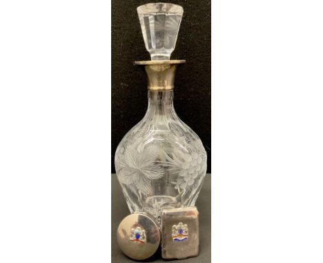 A silver mounted cut glass decanter, London 1970; a silver and enamel circular compact, applied with the Arms of the Orient S